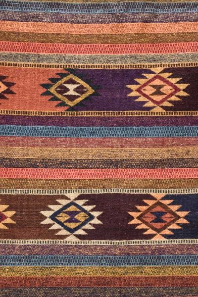 New Mexico, Madrid Detail in colorful woven rug